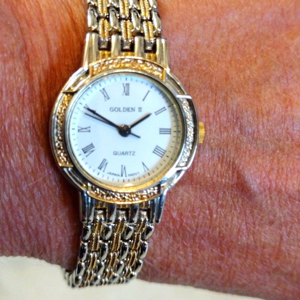 Golden quartz watch.